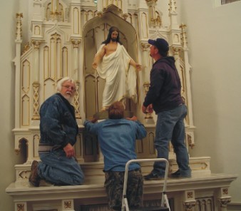 Texas Artist Sandy Dusek,historic altar restoration at St.John Lutheran Church,Bartlett,Tx,installing repaired Jesus statue
